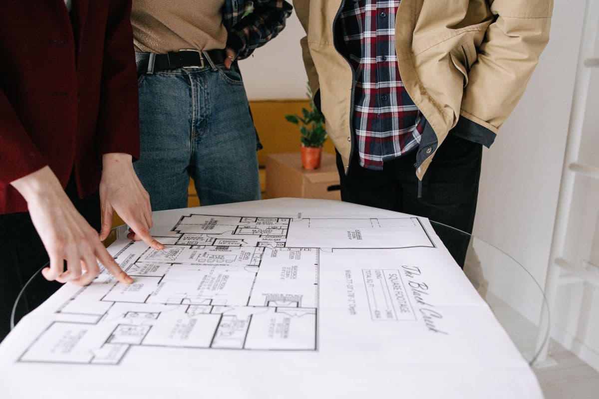 Homeowner and interior designer reviewing a layout plan together in Kharghar