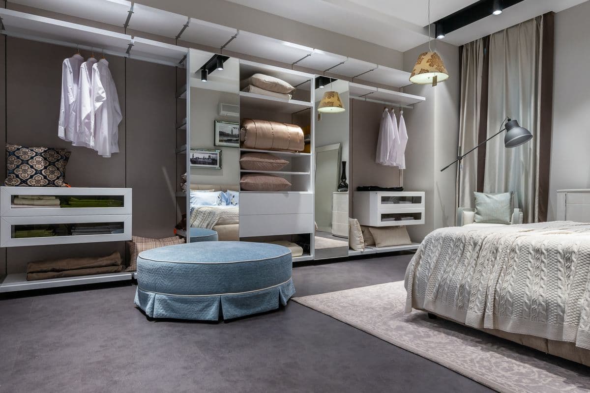 Wardrobe inside layout for a Navi Mumbai bedroom with hanging rails, open shelves and drawers